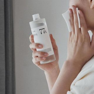 Anua Heartleaf 77% Soothing Toner being applied with toner Pad